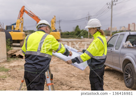 Engineer survey team checking construction project inspection work construction site . Engineer survey team checking construction project inspection work construction site . 136416981