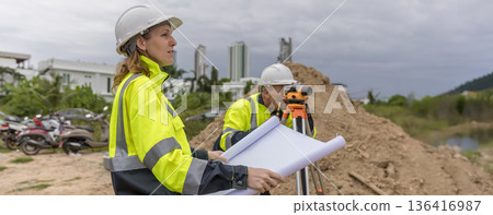 Engineer survey team checking construction project inspection work construction site . Engineer survey team checking construction project inspection work construction site . 136416987