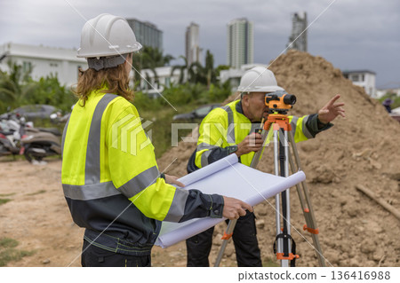 Engineer survey team checking construction project inspection work construction site . Engineer survey team checking construction project inspection work construction site . 136416988
