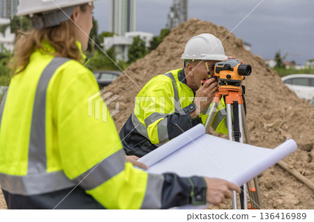Engineer survey team checking construction project inspection work construction site . Engineer survey team checking construction project inspection work construction site . 136416989