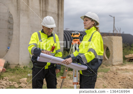Engineer survey team checking construction project inspection work construction site . Engineer survey team checking construction project inspection work construction site . 136416994