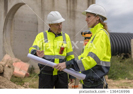 Engineer survey team checking construction project inspection work construction site . Engineer survey team checking construction project inspection work construction site . 136416996