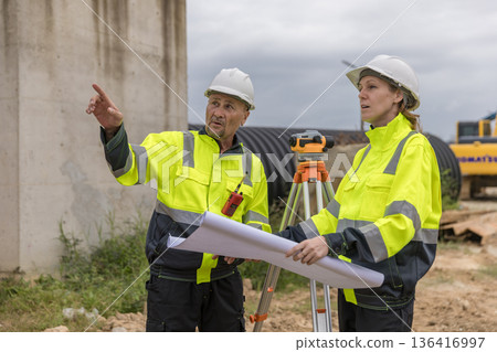 Engineer survey team checking construction project  inspection work construction site . 136416997