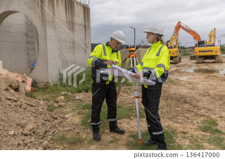 Engineer survey team checking construction project inspection work construction site . Engineer survey team checking construction project inspection work construction site . 136417000