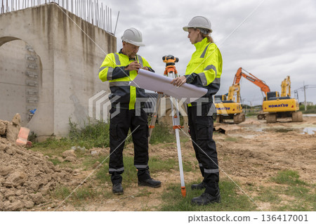 Engineer survey team checking construction project inspection work construction site . Engineer survey team checking construction project inspection work construction site . 136417001
