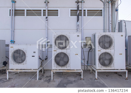 Air conditioner compressor installed in old building. Air conditioner compressor installed in old building. 136417234