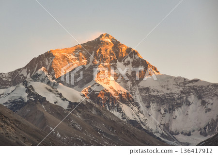 Sun Beams Mark an Orange Glow on Mount Everest 136417912