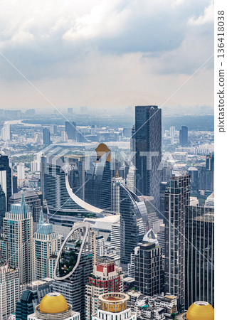 View of Bangkok skyline filled with modern high rise buildings showcasing the city dynamic growth and architectural innovation highlighting urban development View of Bangkok skyline filled with modern high rise buildings showcasing the city dynamic growth and architectural innovation highlighting urban development 136418038