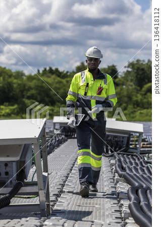 Engineer Checking and working setup Floating solar panels or solar cell Platform system on the lake.  136418112