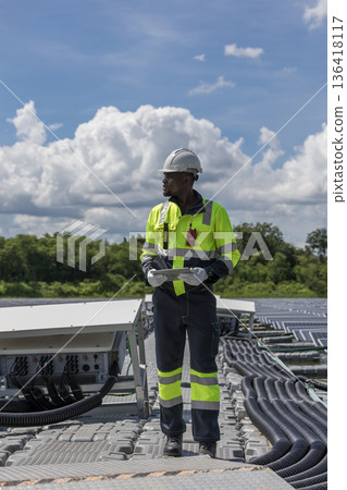 Engineer Checking and working setup Floating solar panels or solar cell Platform system on the lake. Engineer Checking and working setup Floating solar panels or solar cell Platform system on the lake. 136418117