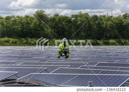 Engineer Checking and working setup Floating solar panels or solar cell Platform system on the lake. Engineer Checking and working setup Floating solar panels or solar cell Platform system on the lake. 136418122