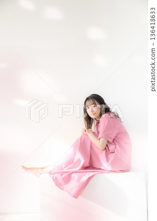 Pink beauty and spring cherry blossoms and happy woman image, full body looking at camera Pink beauty and spring cherry blossoms and happy woman image, full body looking at camera 136418633