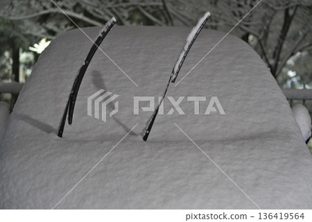 Snow-covered car windshield 136419564
