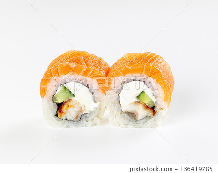 Two Japanese sushi rolls with salmon and eel, cream cheese and cucumber, isolated on a white background. 136419785
