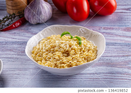 Boiled ptitim pasta served basil 136419852