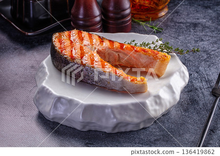Grilled salmon steak served thyme Grilled salmon steak served thyme 136419862