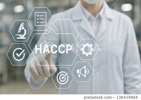 Food safety professional interacting with virtual HACCP interface showing quality control icons in sterile production environment with modern technology Food safety professional interacting with virtual HACCP interface showing quality control icons in sterile production environment with modern technology 136419984