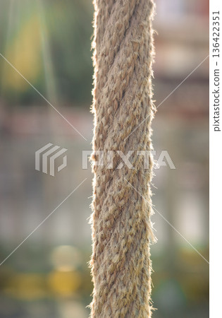 Natural rope texture illuminated by sunlight with soft bokeh background Natural rope texture illuminated by sunlight with soft bokeh background 136422351