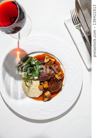 Braised beef with mushroom sauce and puree 136422813