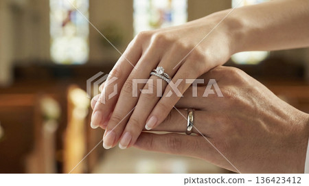 Close-up of the hands of a Japanese bride and groom in wedding attire with wedding rings Close-up of the hands of a Japanese bride and groom in wedding attire with wedding rings 136423412