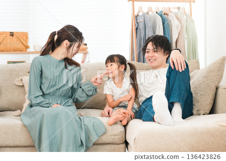 Family relaxing on the sofa at home, family, childcare (affection, family love) Family relaxing on the sofa at home, family, childcare (affection, family love) 136423826
