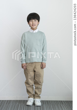 9 year old boy smiling at camera 9 year old boy smiling at camera 136424203