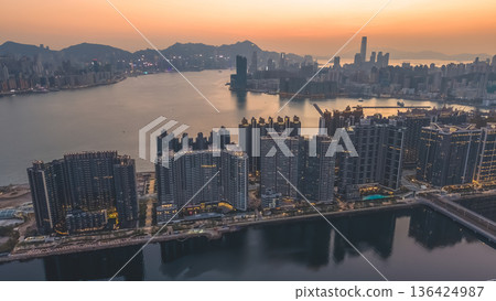 Kowloon Bay skyline glowing during early evening twilight Feb 8 2022 Kowloon Bay skyline glowing during early evening twilight Feb 8 2022 136424987