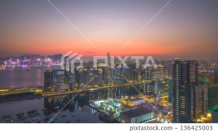 Kowloon Bay skyline glowing during early evening twilight Feb 8 2026 136425003