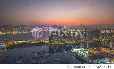 Kowloon Bay skyline glowing during early evening twilight Feb 8 2026 Kowloon Bay skyline glowing during early evening twilight Feb 8 2026 136425013