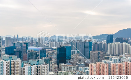 Expansive Kowloon skyline stretches beneath rugged mountain backdrop Feb 8 2026 136425036