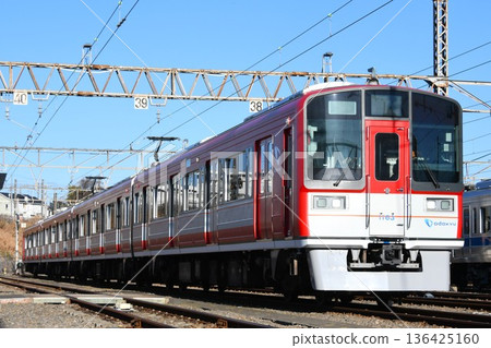 Odakyu Electric Railway 1000 series train in Allegra livery parked at the depot 136425160