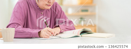 Senior women studying for qualifications at home (correspondence courses, distance learning, dementia prevention) Senior women studying for qualifications at home (correspondence courses, distance learning, dementia prevention) 136425574