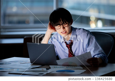 Businessman feeling tired after working overtime Businessman feeling tired after working overtime 136425680