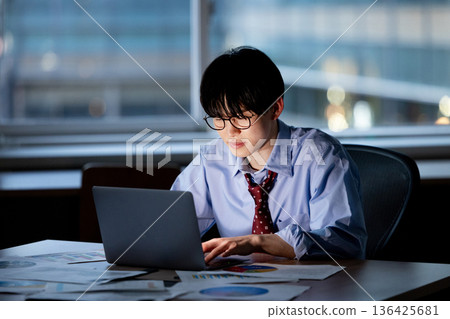 Businessman feeling tired after working overtime Businessman feeling tired after working overtime 136425681