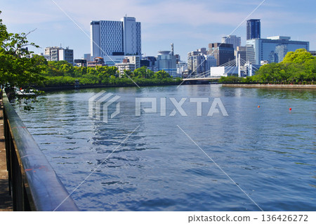 A view of a bridge from a riverside park in Osaka City A view of a bridge from a riverside park in Osaka City 136426272