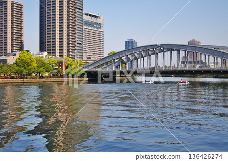 A view of a bridge from a riverside park in Osaka City A view of a bridge from a riverside park in Osaka City 136426274