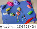 Assorted plasticine sweets candy and lollipops flat lay colorful handmade food toys kids creative play diy craft childhood imagination concept 136426424
