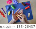Kids modeling master class flat lay step 3 forming small details for handmade plasticine sweets candy and lollipops creative education fine motor skills development diy craft concept 136426437