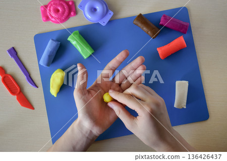 Kids modeling master class flat lay step 3 forming small details for handmade plasticine sweets candy and lollipops creative education fine motor skills development diy craft concept 136426437