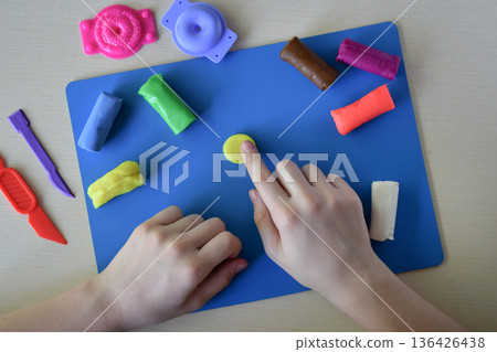 plasticine sweets candy and lollipops food modeling for children flat lay step 4 adding texture and shape to handmade sweets creative diy craft educational activity fine motor skills concept plasticine sweets candy and lollipops food modeling for children flat lay step 4 adding texture and shape to handmade sweets creative diy craft educational activity fine motor skills concept 136426438