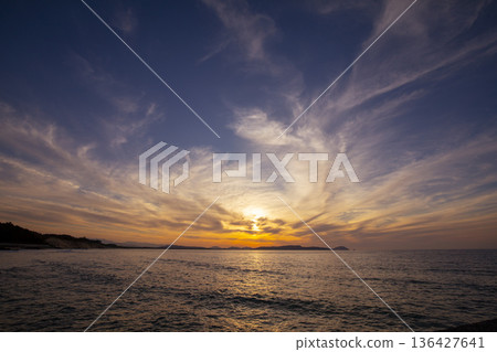 Sunset over Shikanoshima Island seen from the coast of Nata, Fukuoka City (Gannosu Sand Dunes) Sunset over Shikanoshima Island seen from the coast of Nata, Fukuoka City (Gannosu Sand Dunes) 136427641