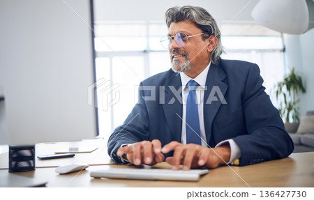 Computer, typing and businessman working in the office on legal corporate project on the internet. Technology, professional and mature male lawyer doing research for law data for a case in workplace. Computer, typing and businessman working in the office on legal corporate project on the internet. Technology, professional and mature male lawyer doing research for law data for a case in workplace. 136427730