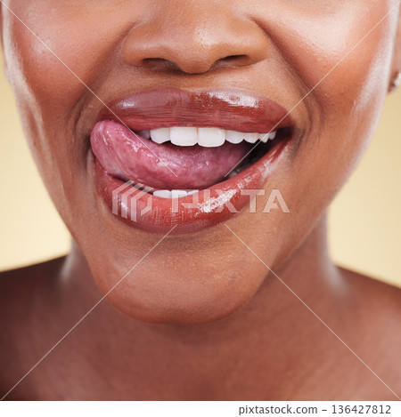 Woman, lips and tongue out, natural beauty and cosmetics, skin and closeup isolated on studio background. Smile, lipstick and makeup with skincare, shine and dermatology, lick and playful with fun Woman, lips and tongue out, natural beauty and cosmetics, skin and closeup isolated on studio background. Smile, lipstick and makeup with skincare, shine and dermatology, lick and playful with fun 136427812