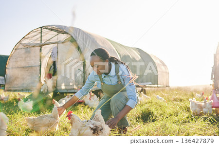 Chicken coop, black woman and agriculture on a eco friendly and sustainable with farm management. Countryside, field and agro farmer with a smile from farming, animal care work and working in nature 136427879