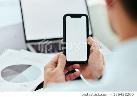 Mockup space, phone and hands of man with laptop in office for internet, connection and mobile app brand. Advertising, technology and business worker online on smartphone for social media with graph 136428200