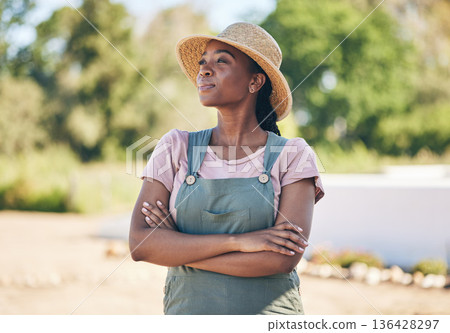 Black woman, thinking and farmer with arms crossed in nature for sustainability outdoor. Idea, agriculture and confident person on land for agro, eco friendly vision and summer garden countryside Black woman, thinking and farmer with arms crossed in nature for sustainability outdoor. Idea, agriculture and confident person on land for agro, eco friendly vision and summer garden countryside 136428297