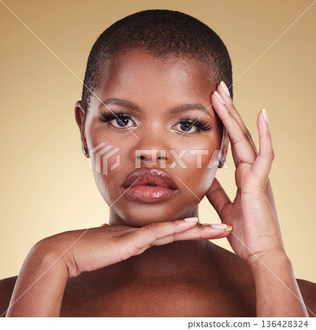 Natural face, makeup and beauty of a black woman in studio for skin care, glow and cosmetics. portrait of African model person with facial shine, dermatology and wellness on a beige background Natural face, makeup and beauty of a black woman in studio for skin care, glow and cosmetics. portrait of African model person with facial shine, dermatology and wellness on a beige background 136428324