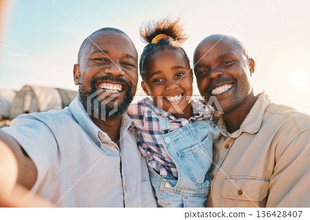 Agriculture, gay and selfie of parents with girl in countryside for holiday, adventure or family vacation. Travel, farm and portrait of lgbtq fathers with child for bonding, relax and fun in nature Agriculture, gay and selfie of parents with girl in countryside for holiday, adventure or family vacation. Travel, farm and portrait of lgbtq fathers with child for bonding, relax and fun in nature 136428407
