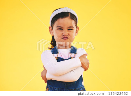 Portrait, arms crossed and angry girl child in studio with bad, attitude or behavior problem on yellow background. Frown, face and asian kid with body language for no, frustrated or tantrum emoji Portrait, arms crossed and angry girl child in studio with bad, attitude or behavior problem on yellow background. Frown, face and asian kid with body language for no, frustrated or tantrum emoji 136428462
