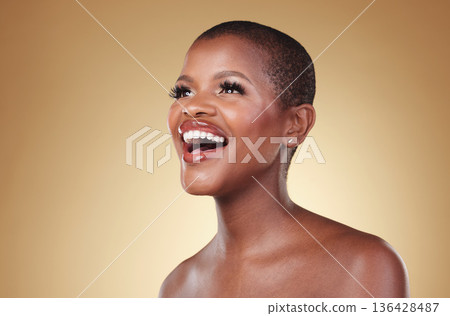 Beauty, laughing and a black woman with makeup in studio for skin care, glow and cosmetics. Face of a happy african person or model with facial shine, dermatology and wellness on a beige background Beauty, laughing and a black woman with makeup in studio for skin care, glow and cosmetics. Face of a happy african person or model with facial shine, dermatology and wellness on a beige background 136428487